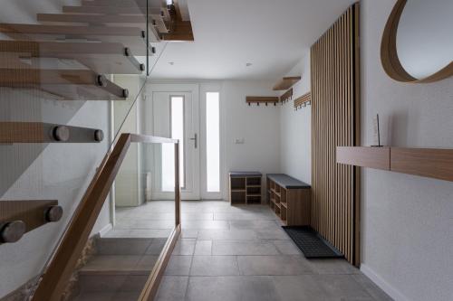a hallway with a staircase in a room at Elbsandsteinlodge in Sebnitz