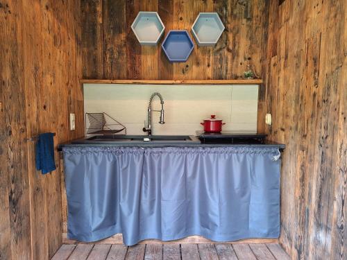 a kitchen with a sink and a counter top at Mazurska Chatka Pilchy in Pilchy