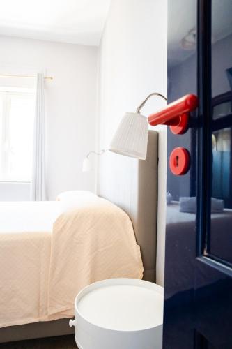 a bedroom with a bed and a white toilet at Innpiero in Taormina