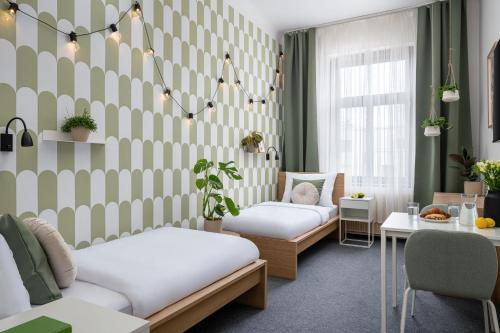 Postel nebo postele na pokoji v ubytování Hotel Riverside by goodnite cz