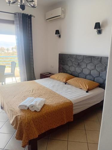 a bedroom with a bed with two towels on it at Appart-Hotel Cabodream beach in Tétouan
