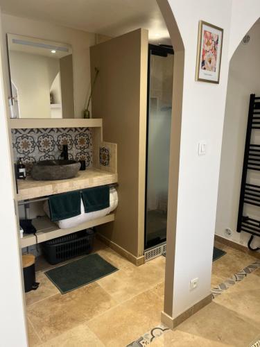 a bathroom with a sink and a shower at Douce escale in Le Crotoy