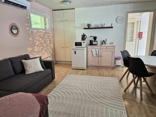 a living room with a couch and a table at Solmula in Keuruu
