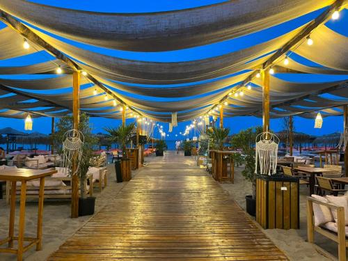a tent on the beach at night with lights at Garsoniere Victor Seaview Aer Conditionat- Bucatarie-Primim Carduri Vacanta-Pet Friendly la 3 minute de Plaja Reyna-Zoom Beach in Constanţa