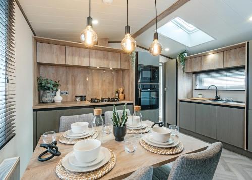 a dining room with a table and chairs in a kitchen at Monarch Lakes in Boston