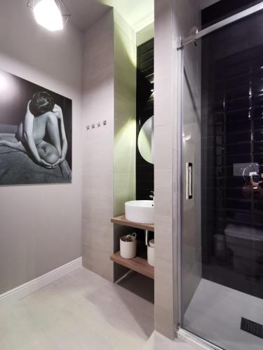 a bathroom with a shower and a sink at FLORENTIN Downtown Design Apt in Bergamo