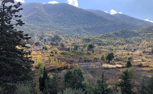 a view of a valley with mountains in the background at Dar el Maasser دار المعاصر in Maasser El Chouf