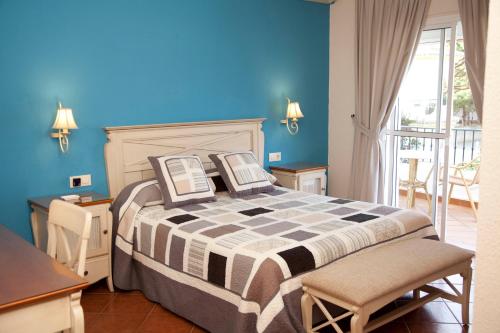 Posteľ alebo postele v izbe v ubytovaní Hostal Los Pinos