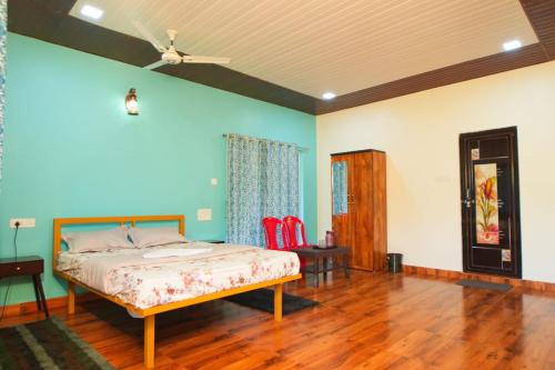 a bedroom with a bed and a wooden floor at Nature's Nook in Ganeshgudi