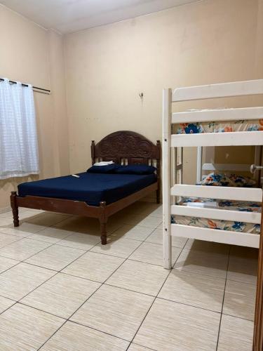 a bedroom with two bunk beds and a shelf at APT da Orla 305 in Santarém