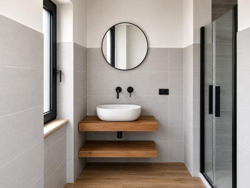 a bathroom with a sink and a mirror at Antana Guest House in Procida
