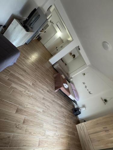 an overhead view of a kitchen with wooden floors at MC Rooms in Torretta