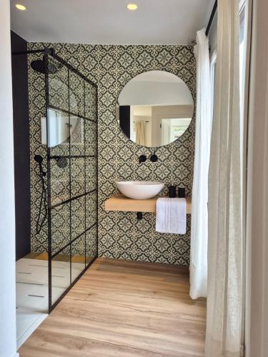 a bathroom with a sink and a mirror at YourHouse O Canton 3 in Lobios