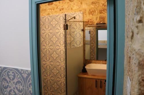 a bathroom with a sink and a mirror at Ayham dream house in Acre