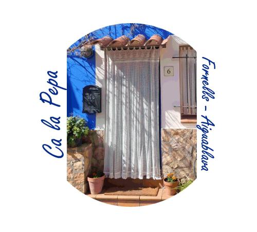 a picture of a door with plants on it at Ca la Pepa in Begur