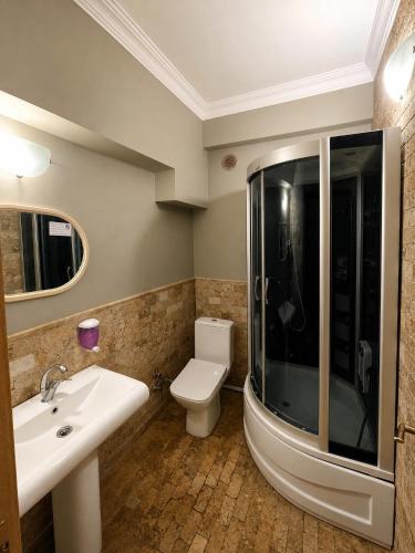 a bathroom with a toilet and a sink and a shower at Royal Park Hotel Corlu Bed and Breakfast in Tekirdağ