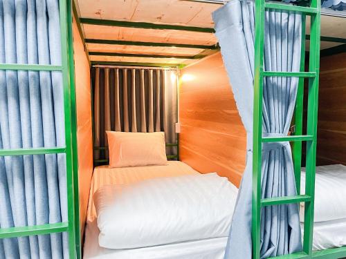 a room with two bunk beds and a bed at HagiangTrips Hotel in Ha Giang