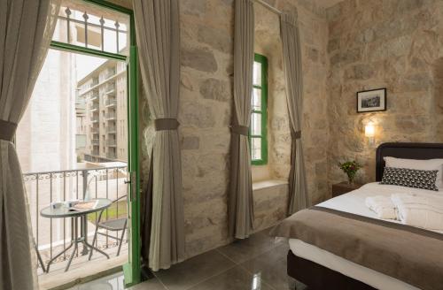 Cama ou camas em um quarto em Heleni Hotel