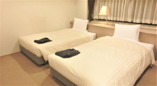 Una cama o camas en una habitación de Hotel Cypress Karuizawa