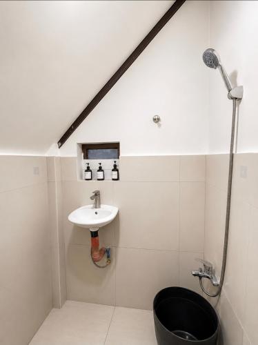 a bathroom with a sink and a shower at Wave Cafe INN in General Luna