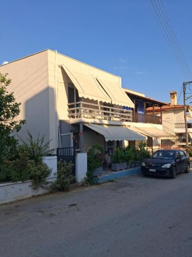 a car parked in front of a building at Kalyves Beach in Kalives Poligirou
