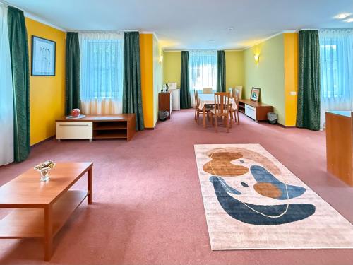a living room with a couch and a table at Lucky Fish Jurmala in Jūrmala