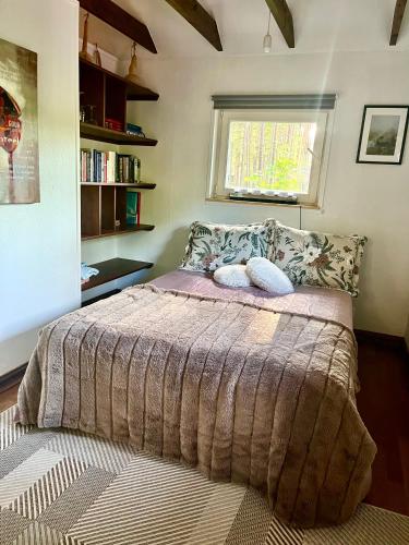 a bedroom with a large bed with a window at Heiniku Home in Elbiku