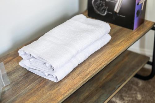 a stack of white towels sitting on a table at The Churchill Hotel in Coventry