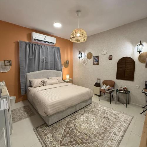a bedroom with a large bed in a room at The Italian Studio7 in Dammam
