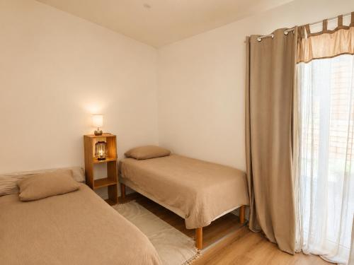 a bedroom with two beds and a window at Home Dream/Erstein/3P/60m2 in Erstein