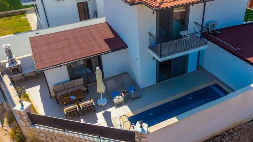 an overhead view of a house with a swimming pool at Villa Kaş B in Kaş
