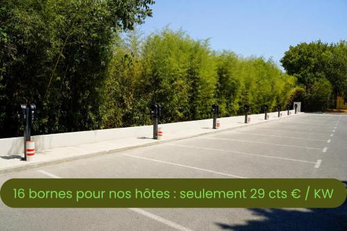 a row of parking meters in a parking lot at Best Western Hotelio Montpellier Sud in Montpellier