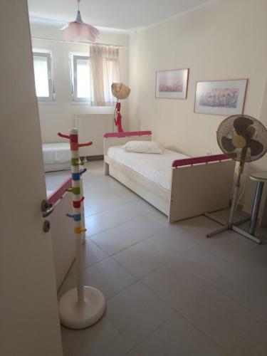 a bedroom with a bed and a table and a lamp at Evi's house in Iraklitsa