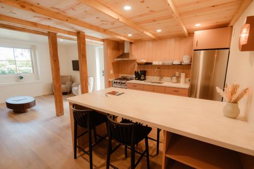 a kitchen with a large island in a room at The Mill House in Bayfield