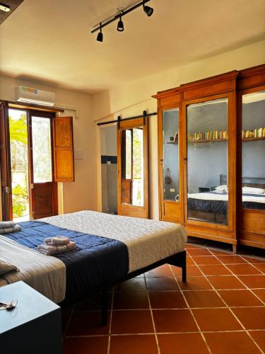 a bedroom with a bed and a cabinet at Ara Solis in Arola