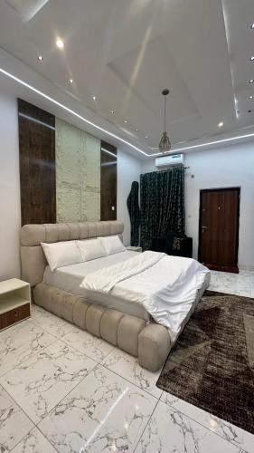 a bedroom with a large bed in a room at Emilomo beautiful homes in Cardoso