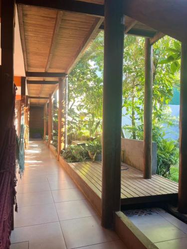 a porch of a house with a view of the ocean at Pousada Almar in Itacaré