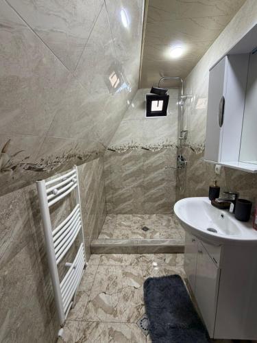 a bathroom with a sink and a toilet at Twenty 23 Cottages,kazbegi 1 in Kazbegi