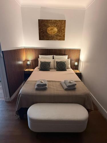 a bedroom with a bed with two towels on it at La pause Saumuroise in Saumur