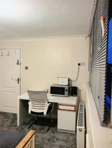 an office with a desk with a printer on it at DD Private Double Room with Shared Bathroom in York