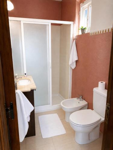 a bathroom with a toilet and a sink at Desert Stars Oasis in Aoufous
