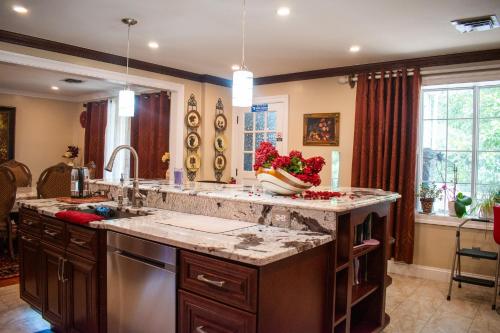 a kitchen with a sink and a counter top at National Harbor Guesthouse in Fort Washington