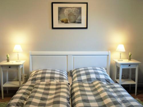 Łóżko lub łóżka w pokoju w obiekcie Ferienhaus N° 14