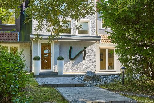 a house with a painting on the front of it at Waldhotel Brand's Busch in Bielefeld