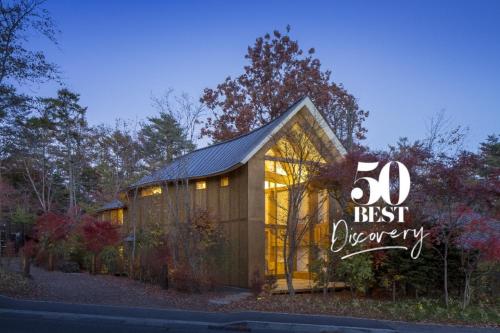 a building with a sign that says best energy at SHISHI-IWA HOUSE Karuizawa in Karuizawa