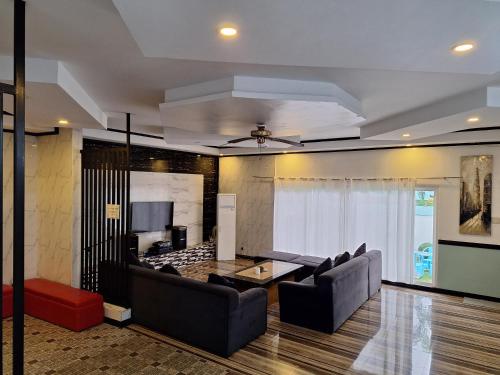 a living room with a couch and a table at Jewelry Resort and Villas Tagaytay in Silang
