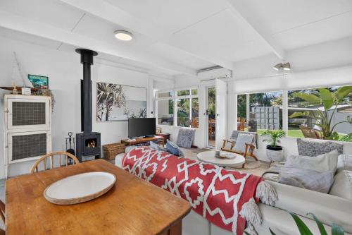 a living room with a couch and a table at River & Tide escape - On Galpin in Goolwa South