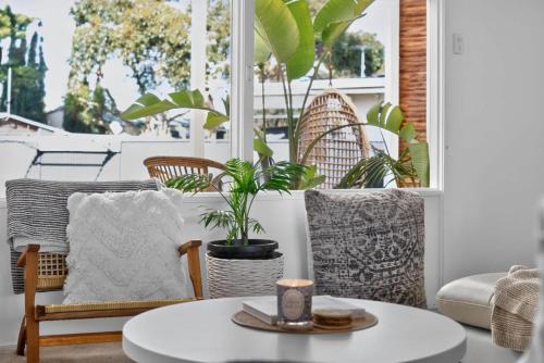 a living room with chairs and a table at River & Tide escape - On Galpin in Goolwa South
