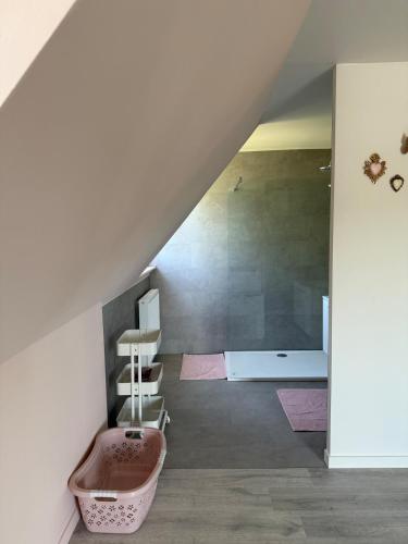 a bathroom with a bath tub and a sink at Maison Frieda in Oostkamp