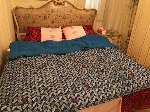 Ліжко або ліжка в номері New Maadi Apartment